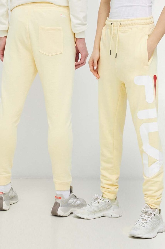 Fila spodnie dresowe Bronte wzorzyste żółty FAU0069.SS23