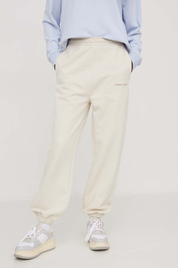 Tommy Jeans spodnie dresowe bawełniane DW0DW17309 beżowy AW24