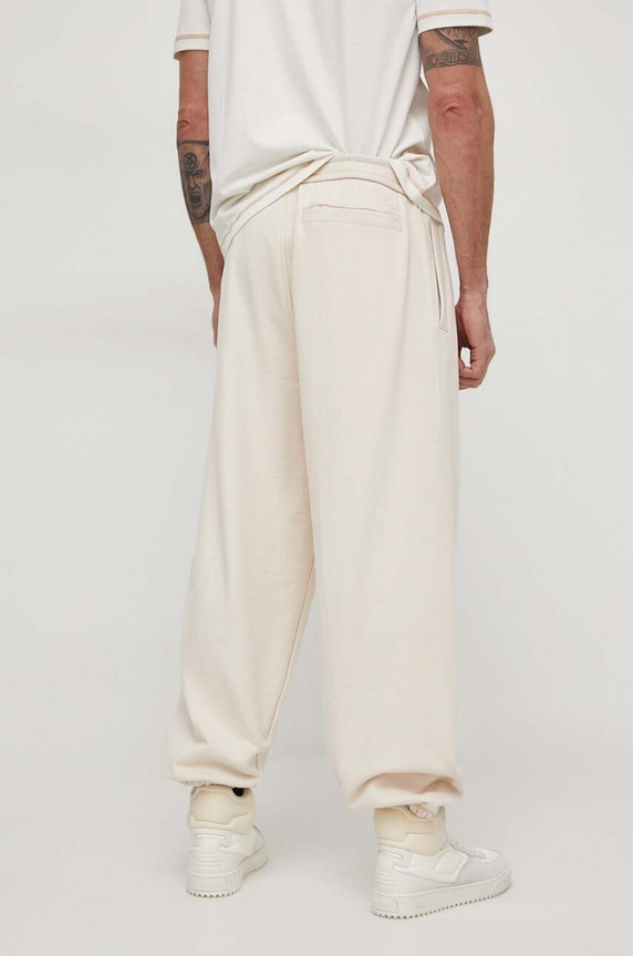 Oblečenie Bavlnené tepláky Calvin Klein Jeans J30J324953 béžová