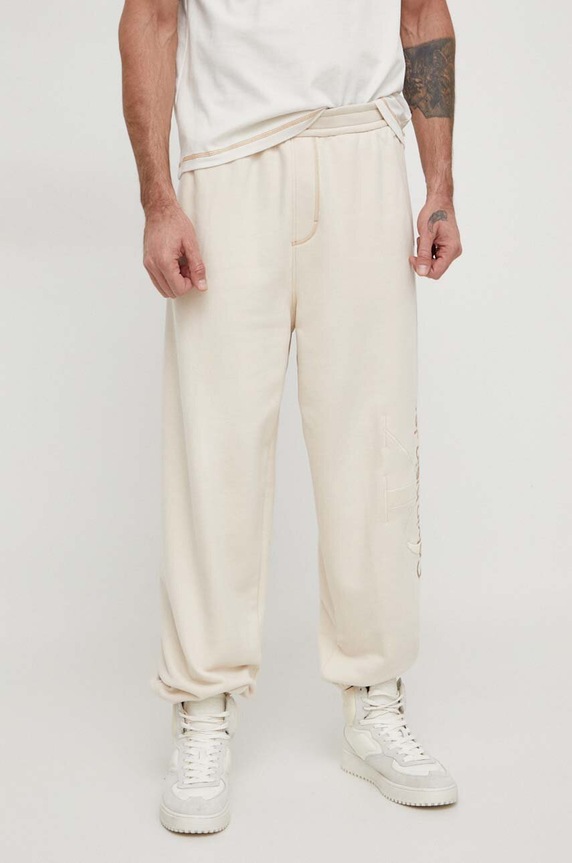 Bavlnené tepláky Calvin Klein Jeans béžová J30J324953