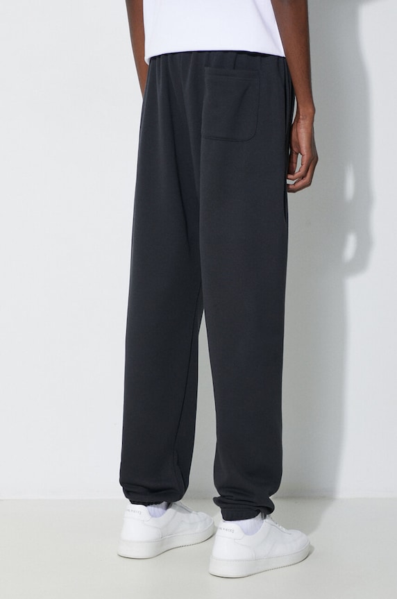 Odzież New Balance spodnie dresowe Essentials French Terry Jogger MP41519BK czarny