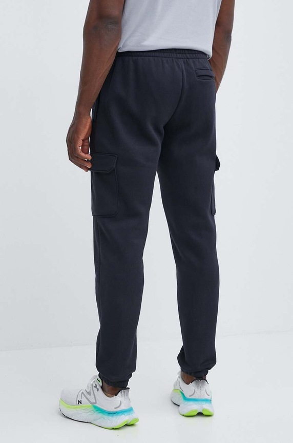 Odzież Under Armour spodnie dresowe Essential 1380376 czarny