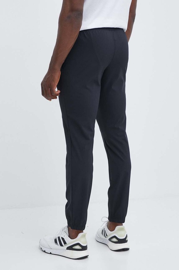 Odzież Under Armour spodnie dresowe 1382119 czarny