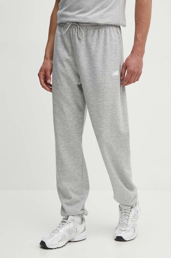 Tepláky New Balance Sport Essentials melanž sivá MP41519AG