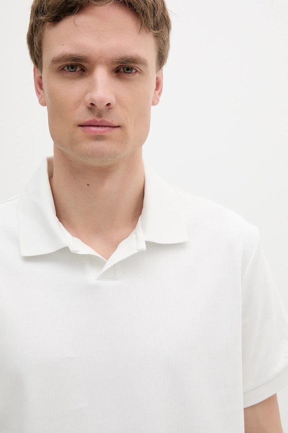 Bombažen polo Calvin Klein Jeans bela LV04RB282G