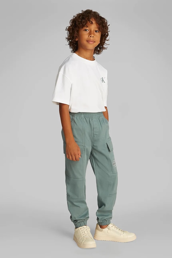 Calvin Klein Jeans spodnie dziecięce ESSENTIAL WOVEN CARGO z elastanem turkusowy IB0IB02270.PPYA