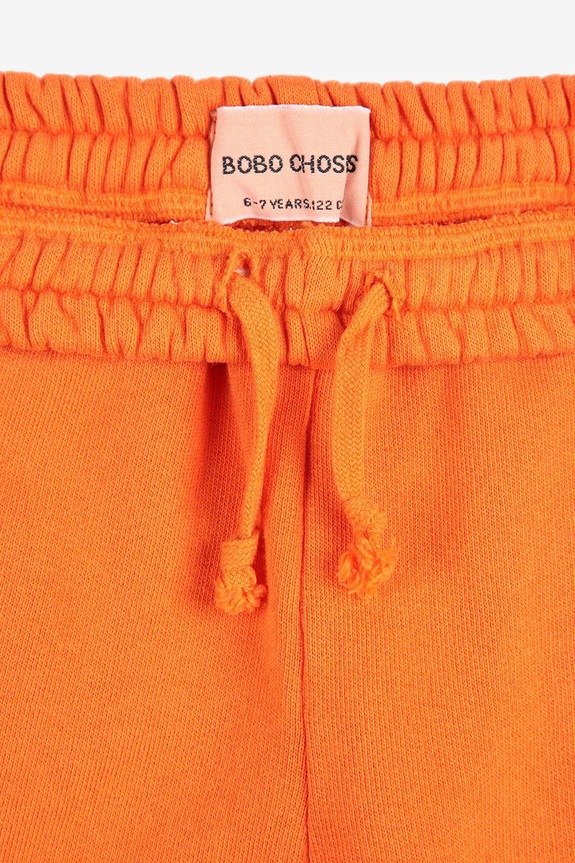 Bobo Choses spodnie dresowe bawełniane dziecięce pomarańczowy 125AC140