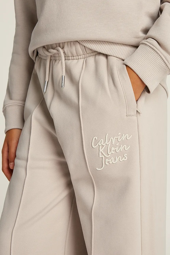 Calvin Klein Jeans spodnie dresowe dziecięce HANDW LOGO WIDE IG0IG02775.128.176.PPYA beżowy