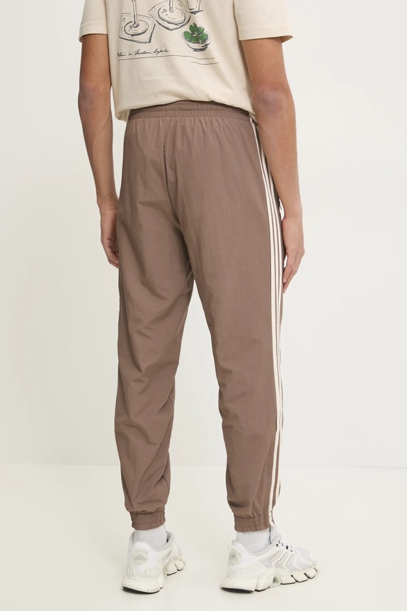 Odzież adidas Originals spodnie dresowe Firebird JP1024 beżowy
