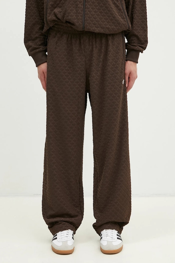 Tepláky adidas Originals Q12 MONOGRAM TR s elastanem hnědá JP4428