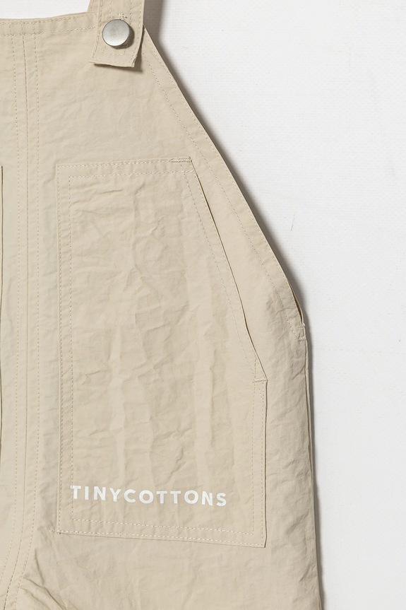 Dječaci Kombinezon za bebe Tinycottons SOLID SHORT DUNGAREE SS25.254 bež