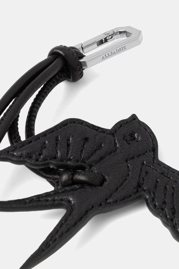 Kožni privjesak AllSaints SWALLOW W127XE crna SS26