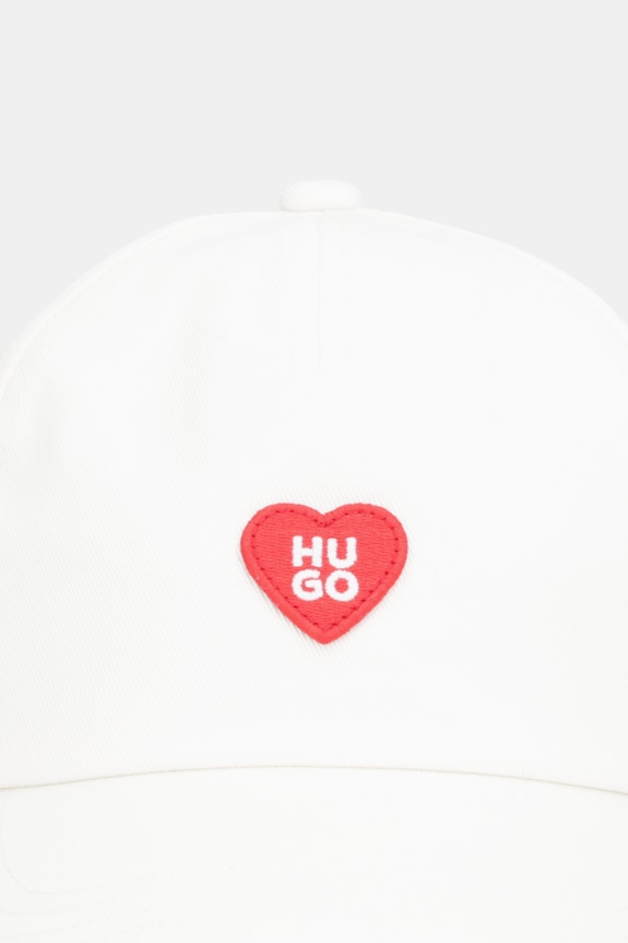Bavlnená šiltovka HUGO Cara-Valentine 50557038 béžová SS26