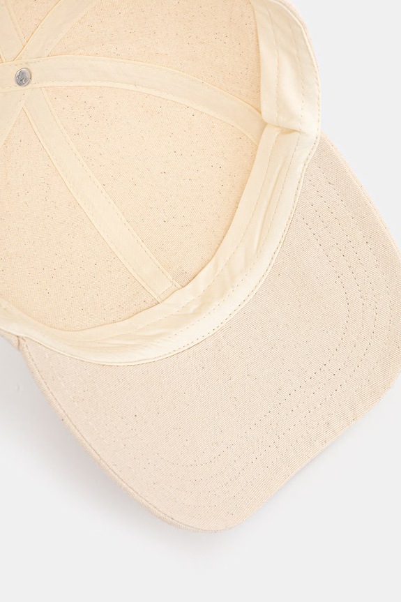 Maison Kitsuné czapka z daszkiem bawełniana Baby Fox beżowy OW06108WB0026