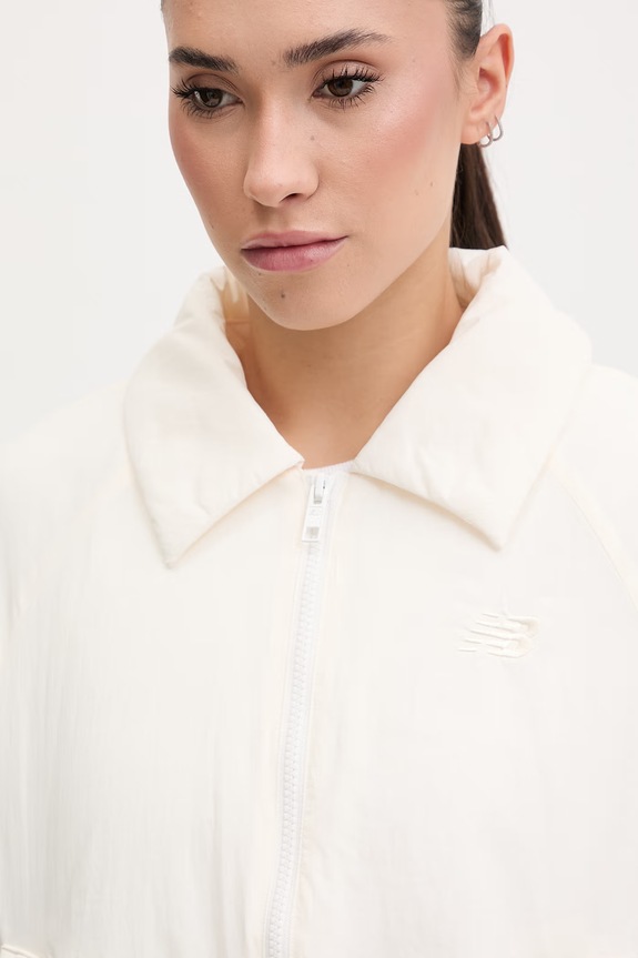 New Balance κοντό μπουφάν Γυναικείο Woven μπεζ WJ61D8YXSST