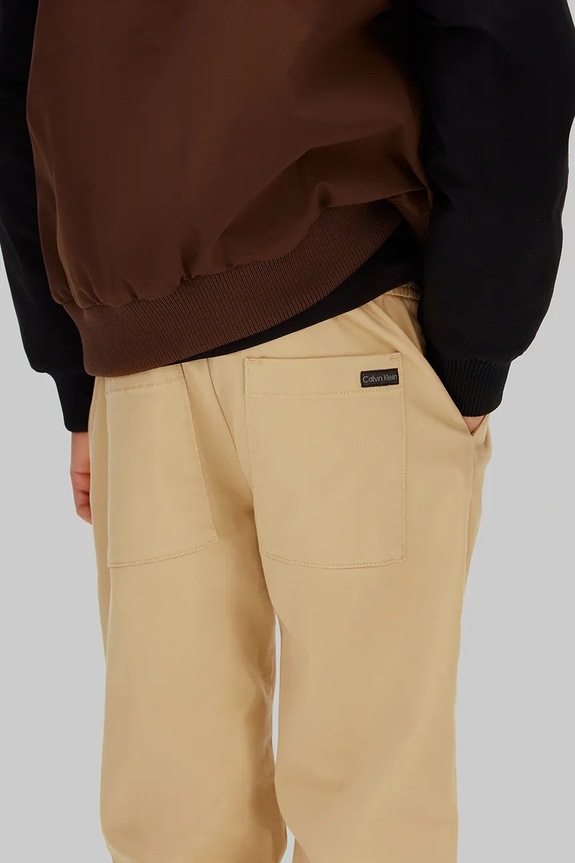 Calvin Klein Jeans gyerek nadrág IB0IB02604.128.176.PPY2 bézs