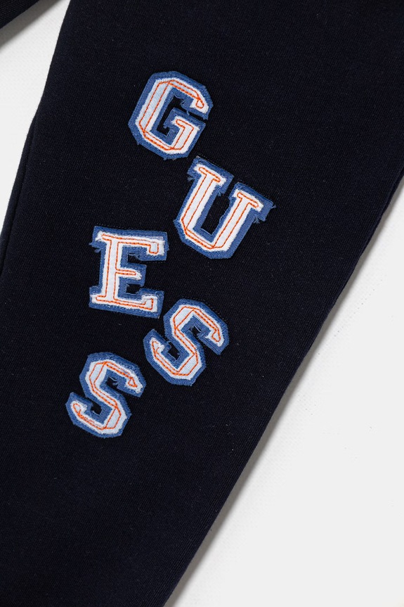 CHLAPEC Dětské bavlněné tepláky Guess N6GB00.KA6R4.PPY2.M námořnická modř