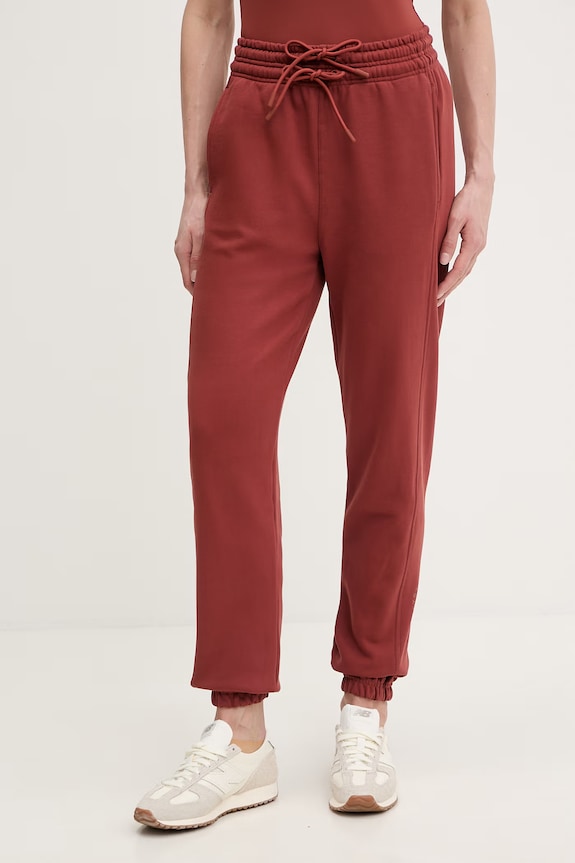 Bavlněné tepláky adidas by Stella McCartney pletenina oranžová JZ0660