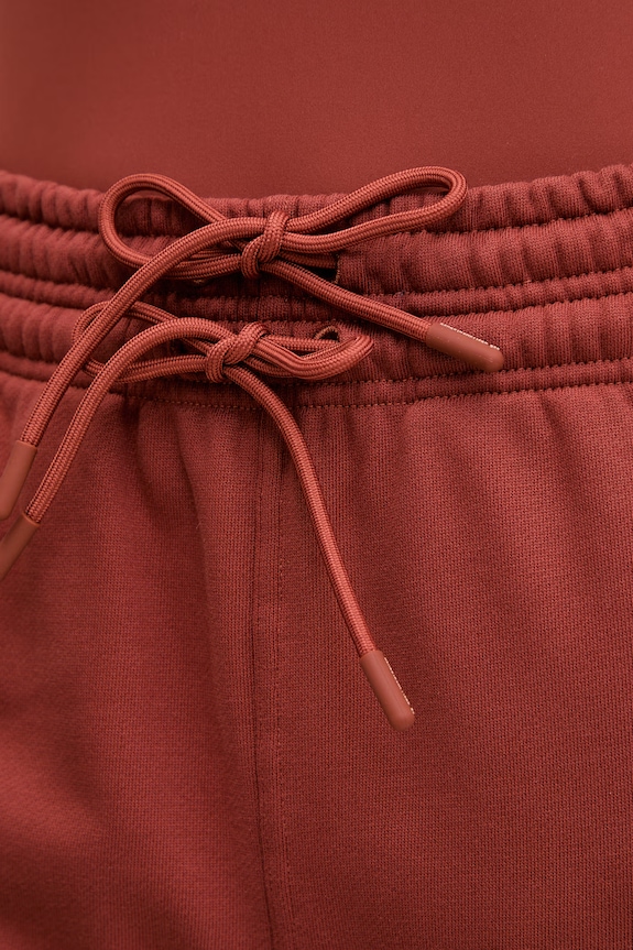 Bavlněné tepláky adidas by Stella McCartney oranžová JZ0660