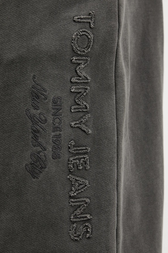 Bavlnené tepláky Tommy Jeans DM0DM22360 sivá