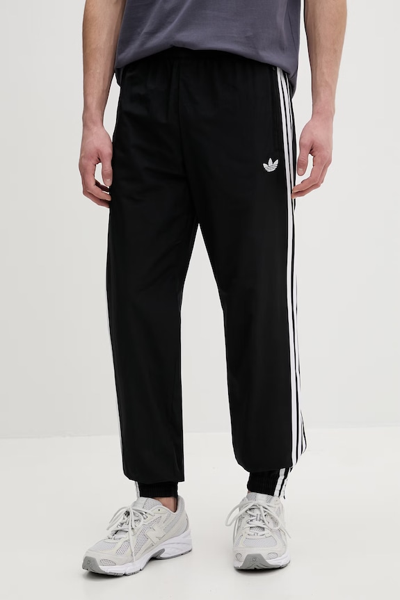 Tepláky adidas Originals Firebird látka černá KE1371