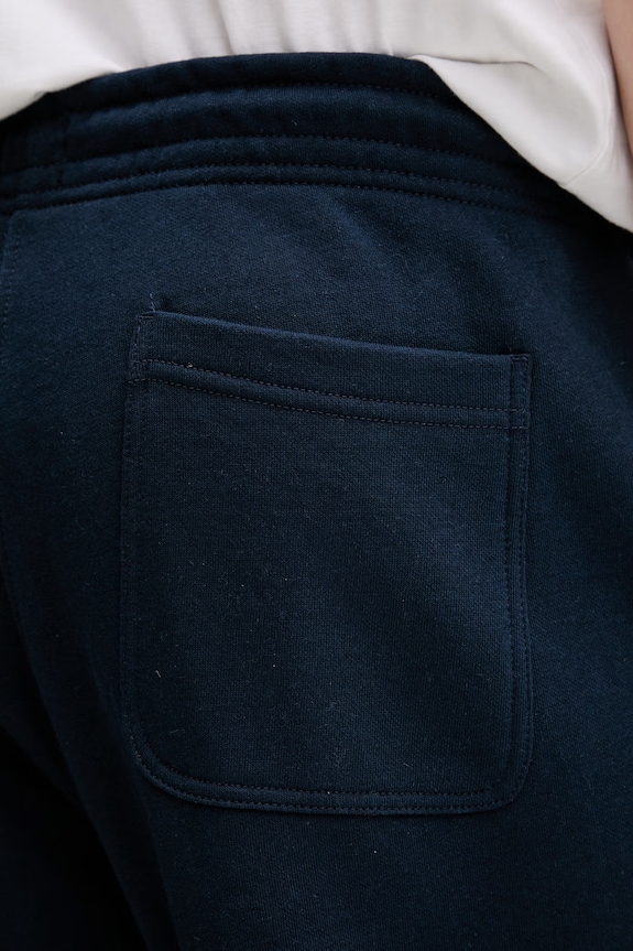 Tommy Jeans pantaloni de trening bărbați cu bumbac DM0DM23014 bleumarin
