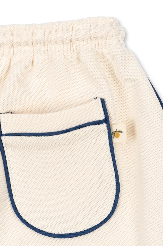 Detské bavlnené šortky Konges Sløjd FLORIAN SHORTS GOTS béžová KS104815.PPY2