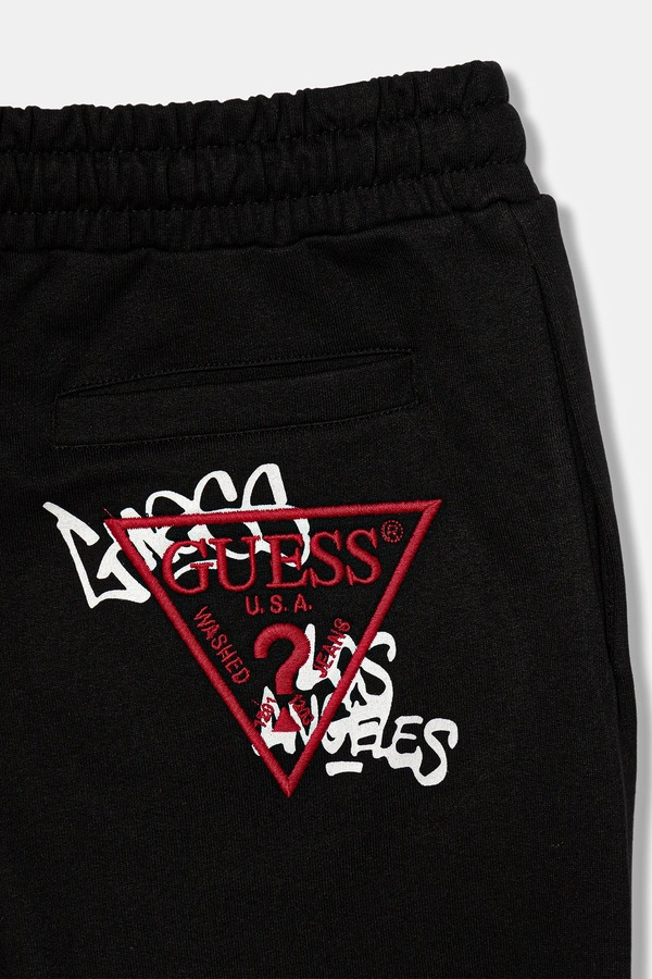 Дитячі бавовняні штани Guess колір чорний фото 3
