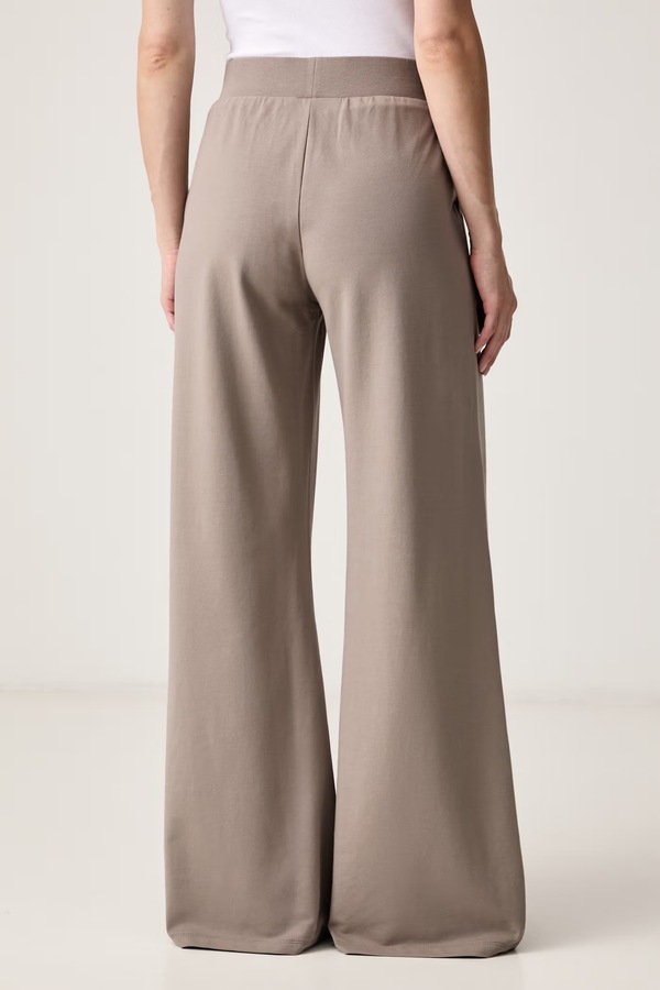 Спортивные брюки женские хлопковые с эластаном EA7 Emporio Armani цвет бежевый фото 2
