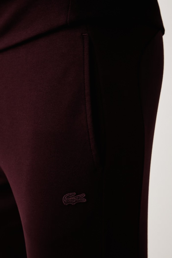 Спортивні штани чоловічі з бавовною Lacoste колір бордовий фото 4
