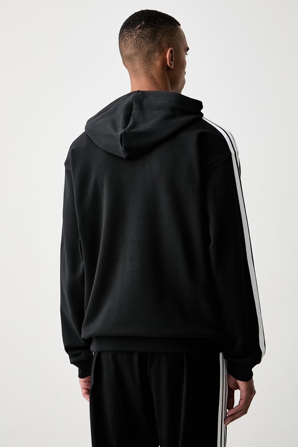 Кофта з капюшоном чоловіча бавовняна adidas Essentials колір чорний фото 2