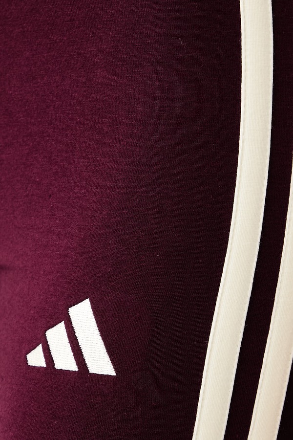 Легінси жіночі з бавовною adidas Essentials колір бордовий фото 4