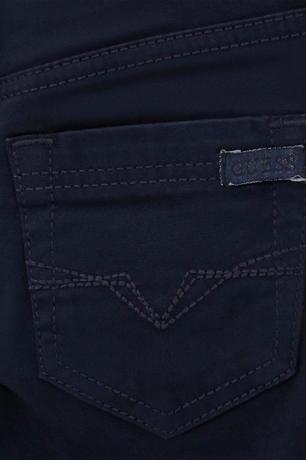 Штани дитячі бавовняні з еластаном Guess колір темно-синій фото 3