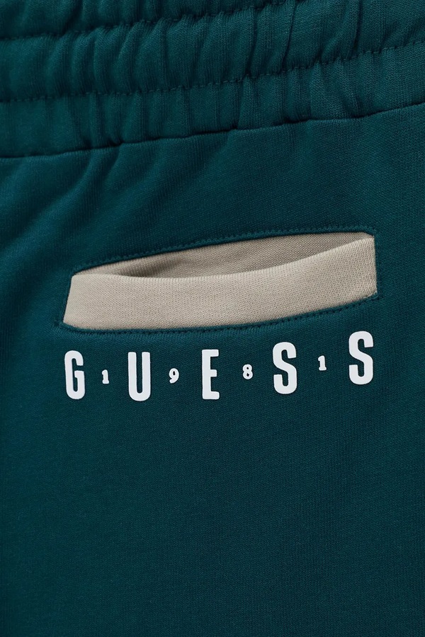 Спортивні штани дитячі бавовняні Guess колір бірюзовий фото 3