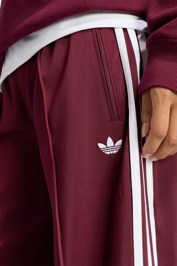 Штани жіночі adidas Originals Firebird Barrel колір бордовий фото 4