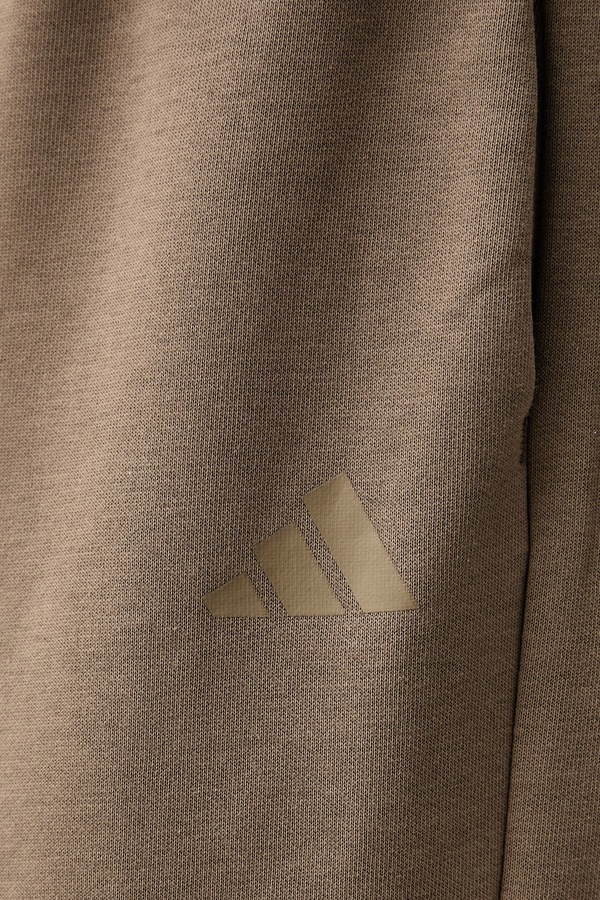 Спортивні штани жіночі з бавовною adidas Soft Lux колір бежевий фото 4