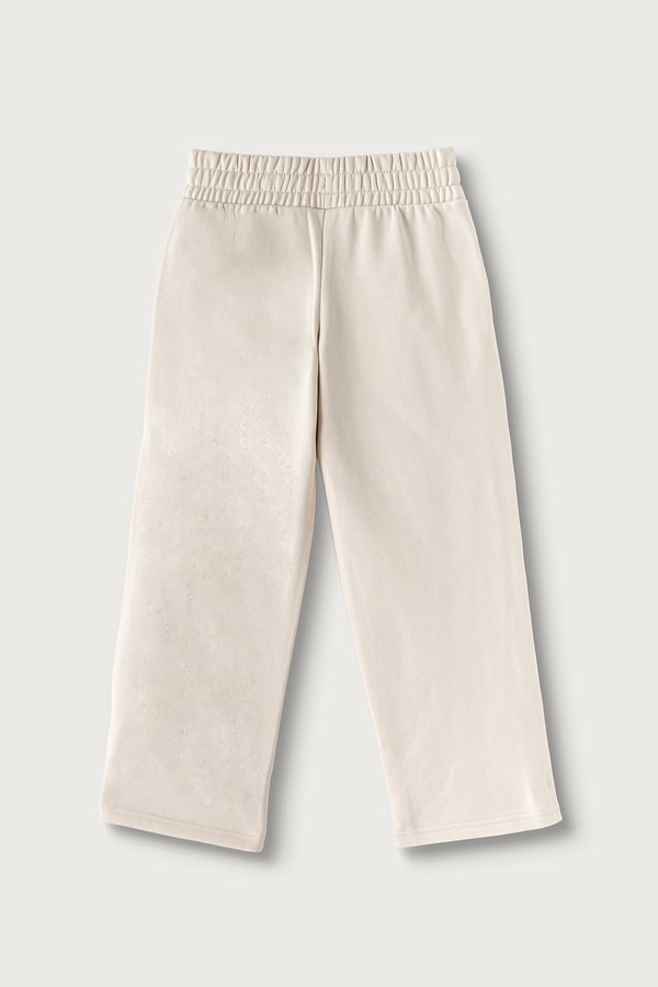 Спортивні штани дитячі з бавовною Puma ESS TAPE Relaxed Sweatpants колір бежевий
