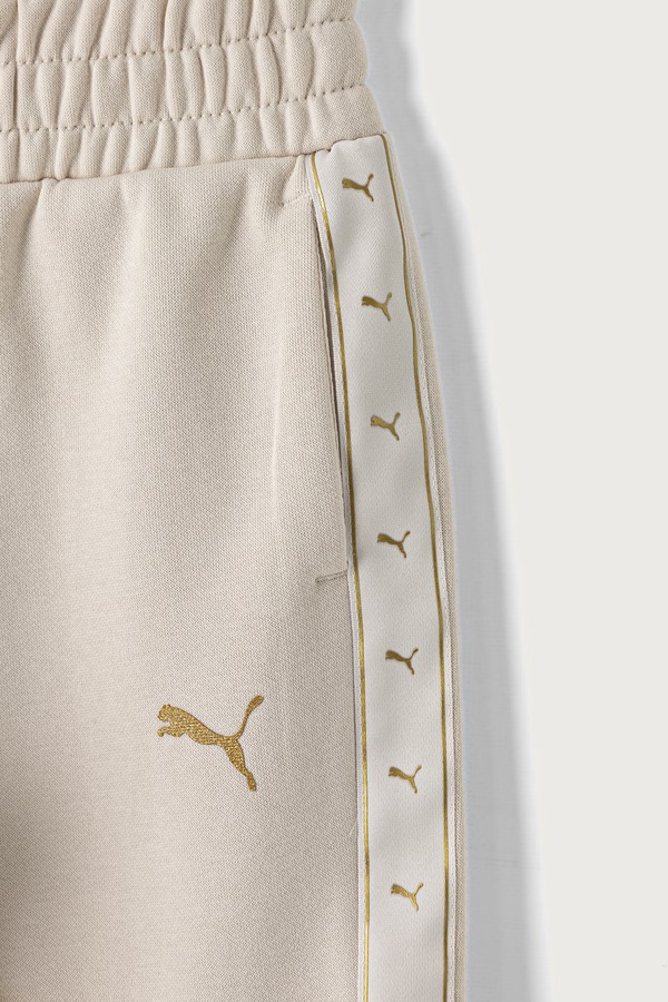 Спортивні штани дитячі з бавовною Puma ESS TAPE Relaxed Sweatpants колір бежевий фото 2