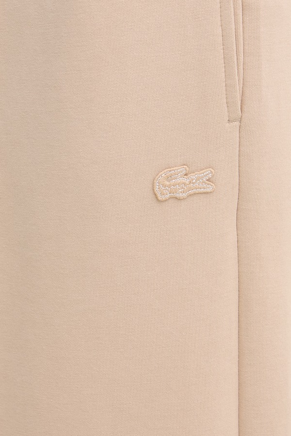 Спортивні штани жіночі Lacoste колір бежевий фото 4