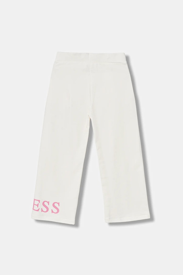 Детские хлопковые брюки Guess цвет бежевый