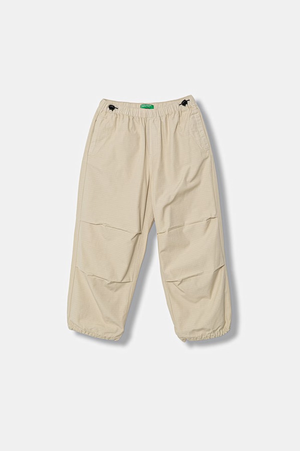 Штани дитячі бавовняні United Colors of Benetton колір бежевий