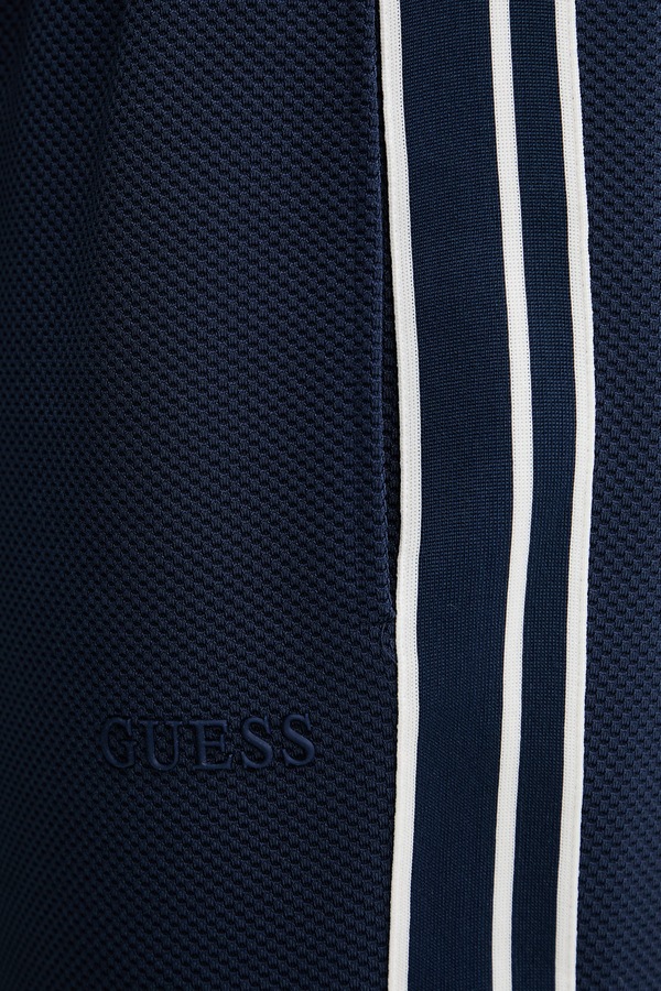 Спортивні штани чоловічі Guess колір темно-синій фото 4