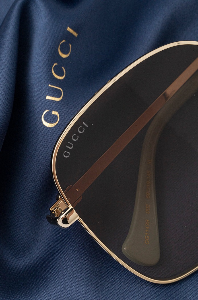 Okulary przeciwsłoneczne Gucci złoty GG1143S