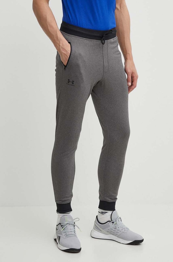 Nohavice Under Armour 1290261. s elastanom sivá 1290261.