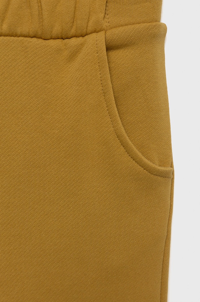 Dziewczynka United Colors of Benetton spodnie dresowe bawełniane dziecięce 3QLAGF015.P żółty