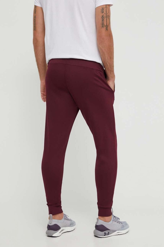 Odzież Under Armour spodnie dresowe Armour Fleece 1373362 bordowy