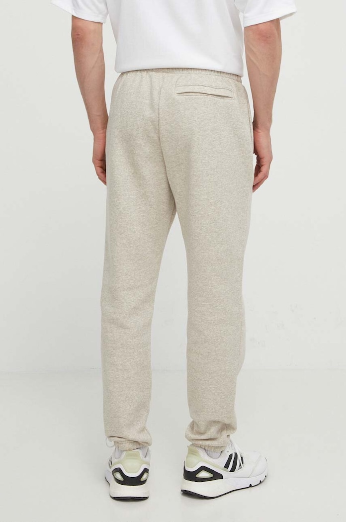 Oblečenie Under Armour teplákové nohavice pánske s bavlnou Essential Fleece 1373882 béžová