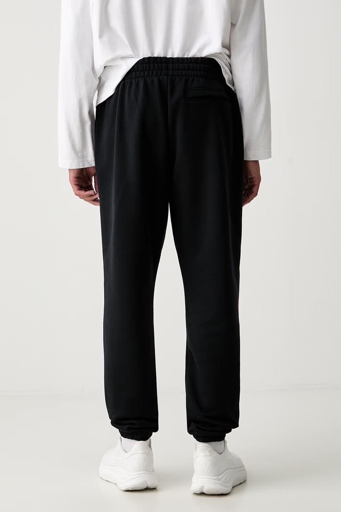 Ruházat Under Armour melegítő férfi pamuttal Essential Fleece 1373882 fekete