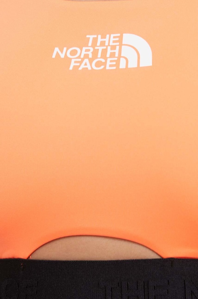 Sportovní podprsenka The North Face Mountain Athletics NF0A8569OVE1 oranžová