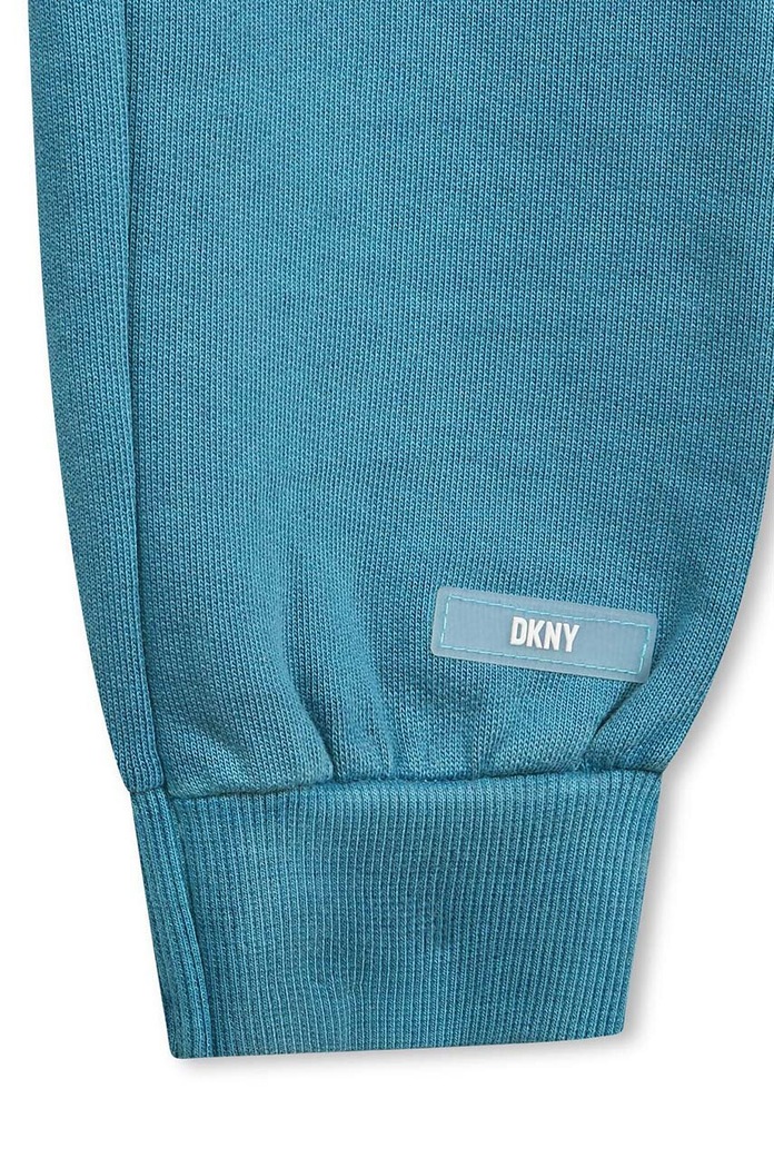 Chłopiec Dkny spodnie dresowe bawełniane dziecięce D54000.162.174 turkusowy